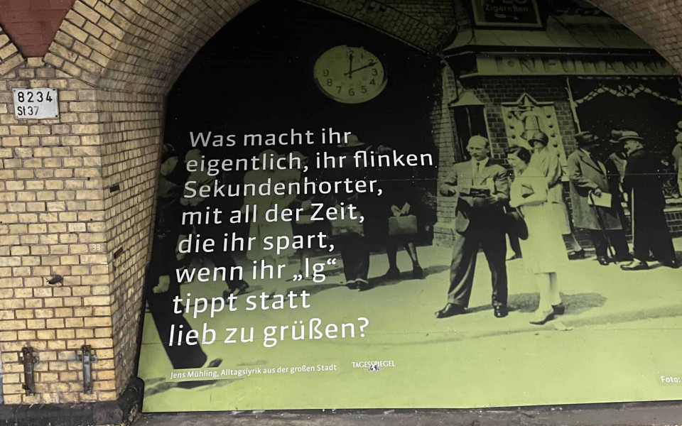 A picture of the sign with a poem by Jens Mühling that is quoted near the end of this blog entry.