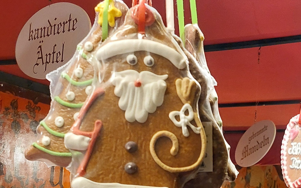 A picture of a gingerbread Santa and gingerbread Christmas tree