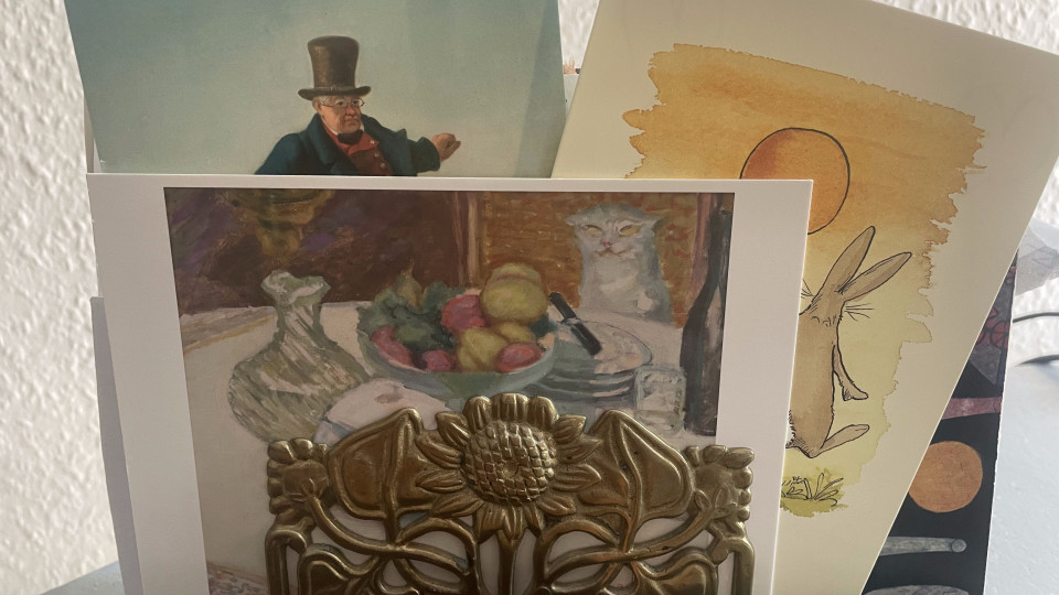 Several postcards on a desk