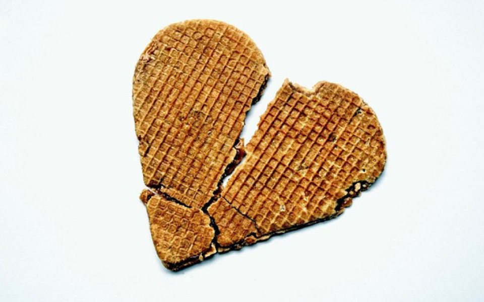 A heart-shaped waffle broken in half.